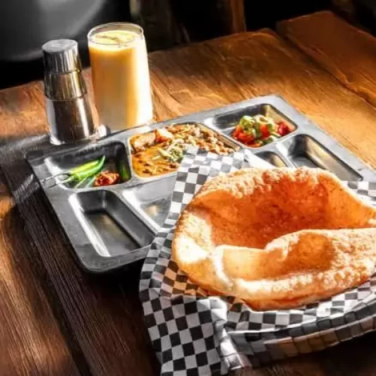 Fresh samosa chatt and Indian appetizers at Spicy Nation vegetarian restaurant Regina